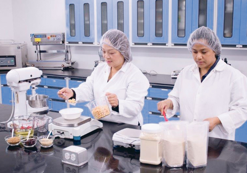 Sara Lui, left, product development manager at the Agri-Food Innovation Centre and Cathy Querimit, senior product development assistant are part of a 50-person staff at the soon-to-be-expanded food centre facility in Saskatoon.   |   Saskatchewan Food Industry Development Centre Inc. photo