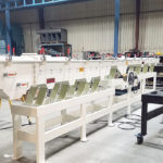 Forsberg’s natural frequency conveyor uses a repetitive shaking motion to gently move grain along to the discharge end. Optional screens can be used to scalp off straw and material larger than the grain. | Can-Seed photo