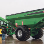 The Brandt 1520XT attracted attention at Regina’s Farm Progress Show, despite the heavy rain. The new design kicks the 20 inch auger 7.5 feet forward from the hitching point, allowing the tractor operator to look to the side with unloading, rather than back. | Michael Raine photo