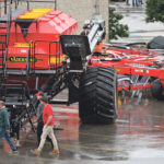 A couple of farmers came prepared last week as rain fell on Canada’s Farm Progress Show in Regina. The show disappointed some visitors and exhibitors, but organizers say they have a plan. | Michael Raine photo