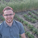 University of Saskatchewan master’s student Dan Malamura says the health of pollinators is important to clover. | Harrison Brooks photo