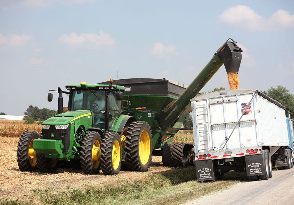 Near Raymond, Illinois a farmer harvests a 200-plus bushel corn crop.  But that was last year in August, this year's crop in the region isn't measuring up as well, or as early.  |  Michael Raine photo