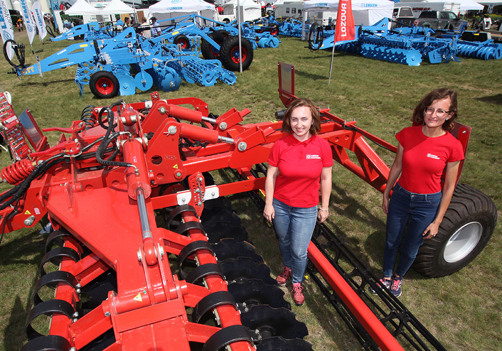 Olena Peleshok, left, and Victoriia Shebanova of Lozova Machinery in Ukraine show off their Ducat compact disc harrow at the Ag in Motion farm show in Langham, Sask.  |  Michael Raine photo