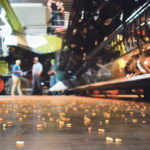 A demonstration of the 5.1 bushels-per-second unload speed of the new Claas Lexion combines left a few kernels of corn behind on the floor of the Mid-America Centre in Council Bluffs, Nebraska. The company released seven new products for North America. | Barb Glen photo