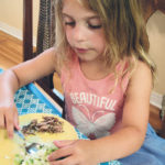 Four-year old Breanna was quite determined to created her own salad with cucumbers, cauliflower, broccoli, mushrooms and rice. She thoroughly enjoyed her creation. | Betty Ann Deobald photo