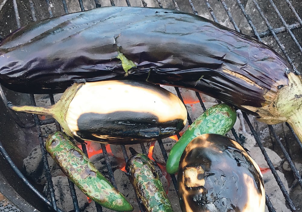 Eggplants come in a variety of shapes and sizes. The white eggplants have a thicker skin and firmer flesh. These must be peeled before using. Eggplants charred over hot coals acquire a smoky flavour.  | Sarah Galvin photo