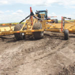 The V-Wings spread out to pull soil into a wide shallow ditch that prevents water erosion. | Ron Lyseng photo