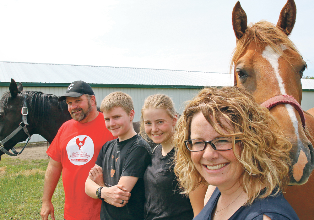 Jeff, Dean, Karlee and Janet Friesen on their farm near Landmark, Man.  |  Ed White photo