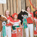 Grand champion at the recent Western Canadian Dairy Classic junior show in Olds, Alta., went to Navi Schalin of Enderby, B.C., right, and reserve went to Cheyanne Haak, also of Enderby. Selections were made by judge Richard Osborne of Hagersville, Ont., far right. | Barbara Duckworth photo