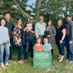 The Hurt family of Crossfield were named Master Farmers by the County of Rockyview. The entire family is involved in the 75 year old mixed operation: Wendy Hurt, left, Daryl, Nicole and Graham Ireland and baby Emery, Ron and Donna Hurt and Krystal and Brad Hurt. In front are MacKenzie Ireland and Abigail Hurt. | Photo courtesy of Donna Hurt