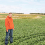 Brenda Bohmer of Bawlf, Alta., stands in a newly seeded perennial strip between an existing wetland and her grain field. The plan is to let the wetland refill and then plant trees around the wetlands. | Mary MacArthur photo