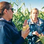 Corteva agronomist Nicole Rasmussen, left, discusses silage corn quality with Agriculture Canada researcher Karen Beauchemin during a Sept. 12 field day organized by AJM Seeds near Lethbridge. | Barb Glen photo
