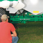 Steering cylinders for the front and rear axles are plumbed into the tractor steering so the trailer automatically follows without scuffing sideways. The driver turns the automatic system off when driving on the highway so the wagon doesn’t try to steer the tractor. | Ron Lyseng photo