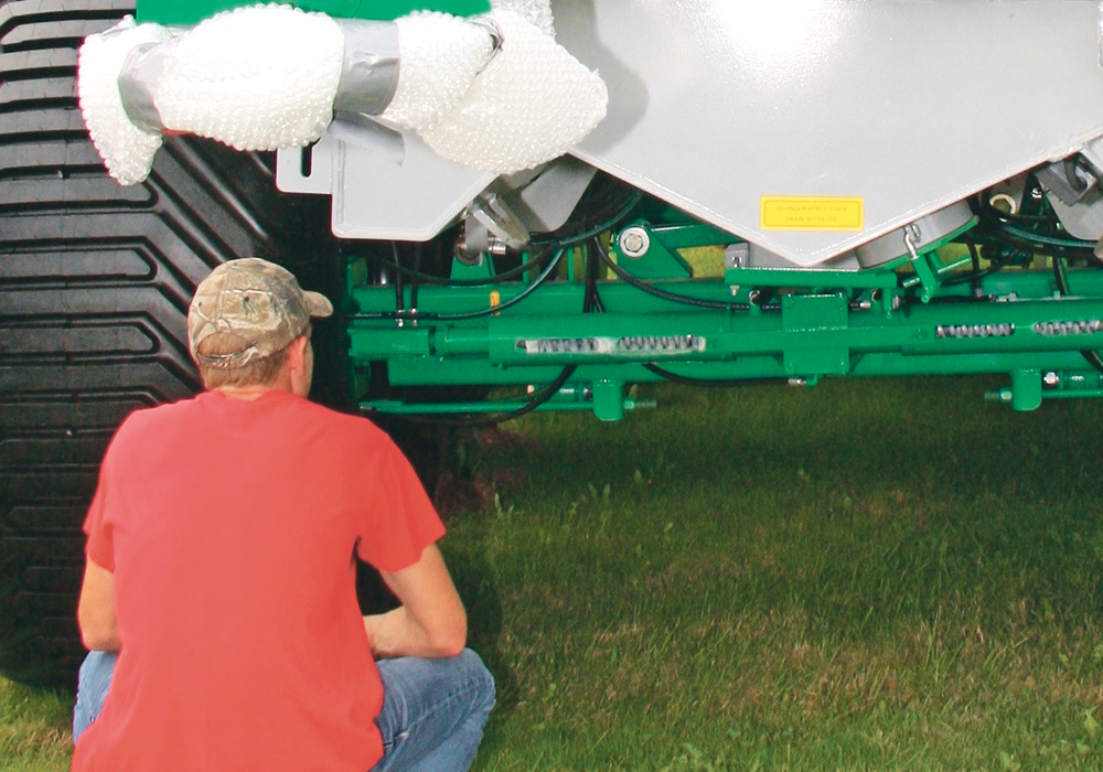 Steering cylinders for the front and rear axles are plumbed into the tractor steering so the trailer automatically follows without scuffing sideways. The driver turns the automatic system off when driving on the highway so the wagon doesn’t try to steer the tractor.  |  Ron Lyseng photo