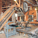Most of the wood working equipment in the Tyrone Mills shop is powered by this overhead belt and pulley system. | Duane McCartney photo