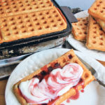 A high fibre version of our family’s favourite waffle recipe is baked in a 50-year-old waffle iron that is still going strong. The waffles are served with yogurt and berry syrup. | Betty Ann Deobald photo