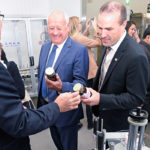 Dan Prefontaine, Food Centre president hands jars of BBQ sauce to Saskatchewan agriculture minister David Marit and Ron Healey, FCL's vice president of Ag and Consumer Business at the Saskatchewan Food Industry Development Centre in Saskatoon, Oct. 4. | William DeKay photo