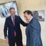 Manitoba Premier Brian Pallister, left, and Paterson GlobalFoods President Andrew Paterson celebrate the announcement of the company’s $94 million oats processing plant. | Ed White photo