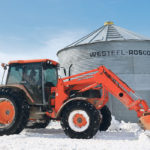 John Nikkel of Nobleford, Alta., finished harvest just before a massive southern Alberta snowfall in the last weekend of September. He was cleaning his yard last week to allow trucks to haul barley from his yard to nearby feedlots. | Mary MacArthur photo