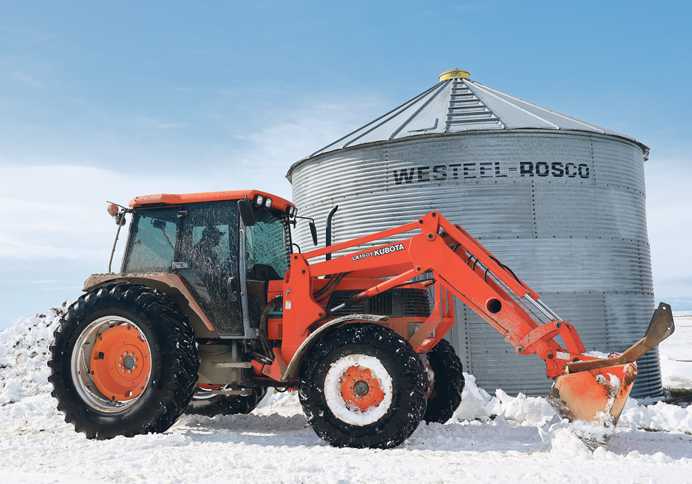 John Nikkel of Nobleford, Alta., finished harvest just before a massive southern Alberta snowfall in the last weekend of September. He was cleaning his yard last week to allow trucks to haul barley from his yard to nearby feedlots.  |  Mary MacArthur photo