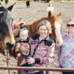 Lacey Marshall, centre, her daughter, Maci, and sister, Jerry-Lynn Marshall, wear shirts from her custom Wildflower Stitchin’ brand. | Photo courtesy of Lacey Marshall