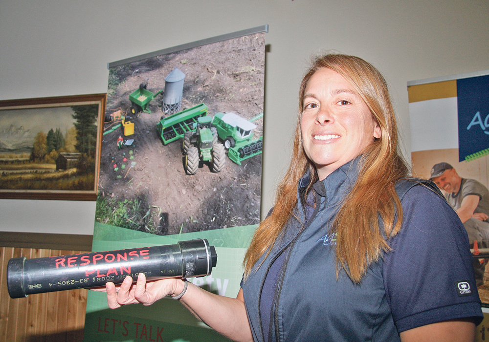 Maria Champagne of AgSafe Alberta promotes farm safety and provides practical advice to keep people safe. Rural residents can place emergency information in a plastic tube and attach it in a prominent place so first responders can help quickly. The tube can hold a farm diagram, information about power shutoffs, critical phone numbers and land locations.  |  Barbara Duckworth photo