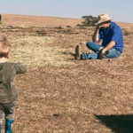 Jason Wright struggles with his emotions in front of his son. The farmer is among many Australian producers facing devastation as a year-long drought continues. | Amber Wright photo