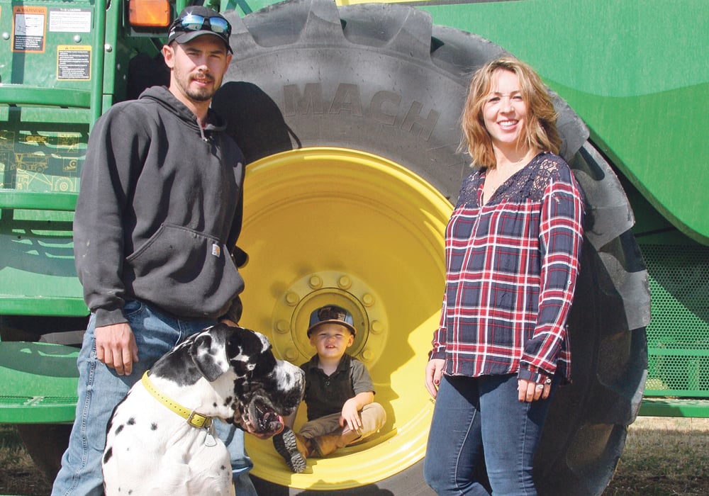 Brendon, Porter and Rustie Sobchuk, along with Great Dane Pete, enjoy life on their farm near Lang, Sask. | Karen Briere photo