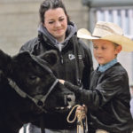 Kurt Pedersen of Pedersen Livestock stands with Kaylee Duncan. He won the Pee Wee Grand Champion title at Edmonton Farmfair last week. | Jeremy Simes photo