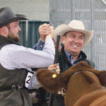 After winning the grand champion Simmental female, Tim Massey right, of New Trend Cattle locks hands with the reserve champion. | Jeremy Simes photo