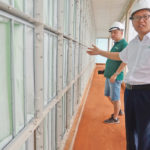 Zhang Xiangjun, manager of New Hope Liuhe’s Binh Phuoc pig farm, shows off the farm’s air filtering systems as part of its biosecurity measures against African swine fever in Binh Phuoc, Vietnam. | REUTERS/Hallie Gu photo