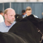 Justin Morrison of Brooking Angus shows his winning grand champion Black Angus bull at Farmfair. | Jeremy Simes photo