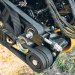 Belts drive the feeder drum, feeder draper and left draper. Both power takeoffs come off the feeder house of the combine. | Honeybee photo