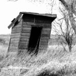 The outhouse underwent remodeling as time marched on with the shanty style giving way to a peak roof and the half-moon in the door becoming diamond-shaped. | Alma Barkman photo