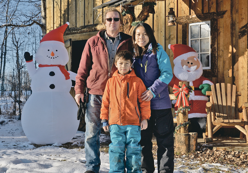 Gary, Susana and Ryker Porttin have created a winter wonderland at R Family Tree Farm.  | Maria Johnson photo