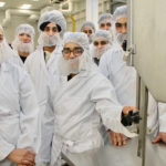 Jasmeen Kaur, middle, and Kirandeep Bhullar, left, are two of the 38 students in the food processing and meat cutting course at Assiniboine Community College in Brandon. The students, mostly from India and China, are training in a new facility at college, which hosted a grand opening Jan. 22 | Robert Arnason photo