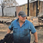 Tim Salway, a fifth-generation dairy farmer who lost both his father and brother in the bushfires, stands in his farm in Wandella, near the town of Cobargo, New South Wales, Jan. 13. Much of Salway’s farm was destroyed by bushfires, including storage facilities, fences and hundreds of cattle. | REUTERS/Alkis Konstantinidis photo