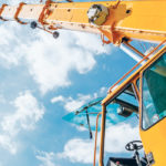 Telehandlers’ ability to hoist heavy loads skyward has made them handy additions on many farms, but that same ability can make them dangerous, with power lines and rollovers being the two most common accidents. | Brigade Electronics