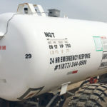 The grey box on the top of the tank is the Tattle device, which is connected to a sensor and a black dial on the side of the tank, indicating the product level in the tank. | North Star Systems photo