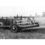 Bill Woronuk’s stook sweep was attached to George Lazoruk’s tractor in 1943. | Photo courtesy of John Woronuk