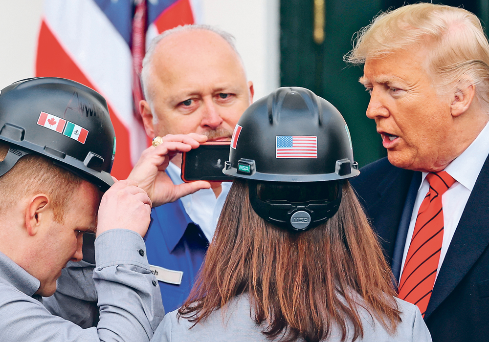 U.S. President Donald Trump greets guests after signing the United States-Mexico-Canada Agreement  trade deal in January. Much of Canada’s agricultural sector hopes Canada will soon do the same. |   REUTERS/Jonathan Ernst photo