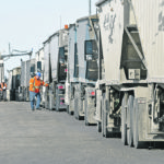 Grain trucks lined up at the gate at the Cargill Ag Horizon facility near Clavet, Sask., March 20. Space in Western Canada's elvator system is tight, but bulk movement is expected to imrpve. | William DeKay photo