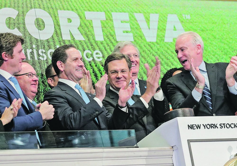 Jim Collins, chief executive officer of Corteva Agriscience, rings the opening bell at the New York Stock Exchange last June. The company is looking forward to a better year for farmers.  |  Reuters/Brendan McDermid photo