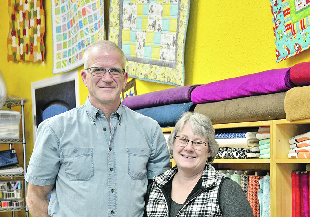 Don and Lynn Burdett in the Prairie Points Quilt Shop on their No Regrets Ranch acreage. Lynn, a lifelong seamstress, was drawn to quilting as therapy when dealing with the death of two of her best friends in 2005. The quilting evolved into a retail business, which was located in nearby Ponoka for five years. Lynn opened the store in her home in 2017.   |  Maria Johnson photo