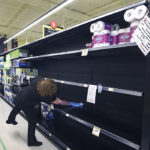 Shelves that normally, pre-COVID-19, would hold bathroom tissue are wiped clean at a grocery store in Warman, Sask. March 26. | William DeKay photo