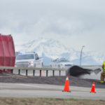 Fire crews and police clean up canola spilled onto Hwy 23 just east of the High River overpass Monday. | Mike Sturk photo