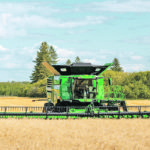 X9 combines have wider feeder-houses, dual separatora, and over 70 square feet of grain processor. Also for 2021 are new headers including drapers up to 50 feet. | John Deere photo
