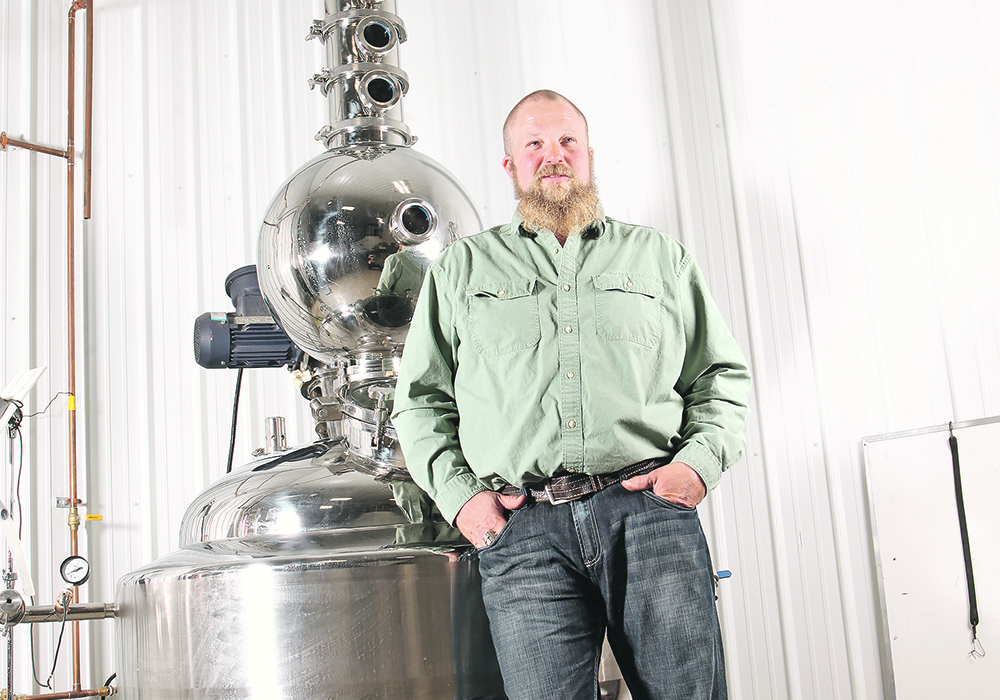 Kevin Lefsrud, who farms near Viking, Alta., started distilling honey as a way to find a creative outlet after retiring from the CFL because of concussions. | Section 35 photo