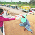 Opportunities for Canadian agricultural products are expanding as the world deals with supply chain disruptions. A health worker checks the temperature of a labourer arriving atop a trailer of wheat at a wholesale grain market in Chandigarh, India. | Reuters/Ajay Verma photo