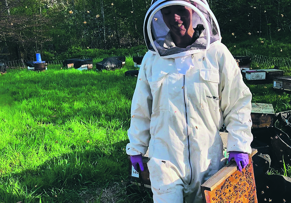 Alison McAfee, biochemist at the Michael Smith Laboratories at UBC, and post-doctoral fellow, North Carolina State University with her subjects.  |  UBC photo